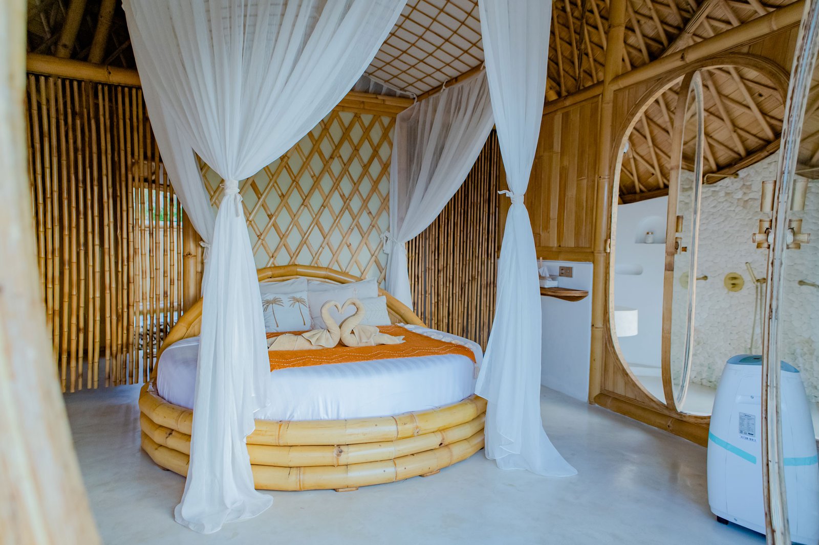 Beautiful bamboo bedroom with round bed and canopy curtains at Camanta Penida villa Beautiful bamboo bedroom with round bed and canopy curtains at Camanta Penida villa