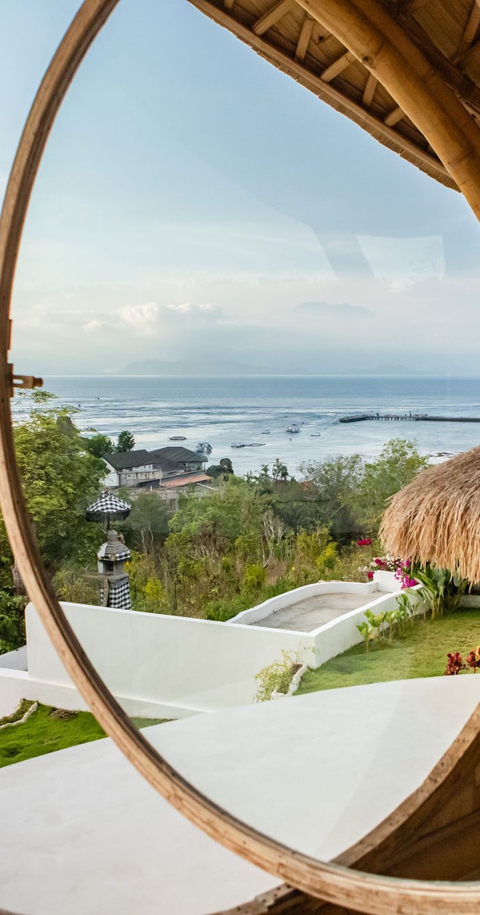 breathtaking ocean view from unique round bamboo window at Camanta Penida villa