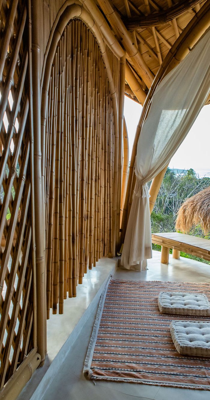Scenic ocean view through a signature round bamboo window at Camanta Penida villa